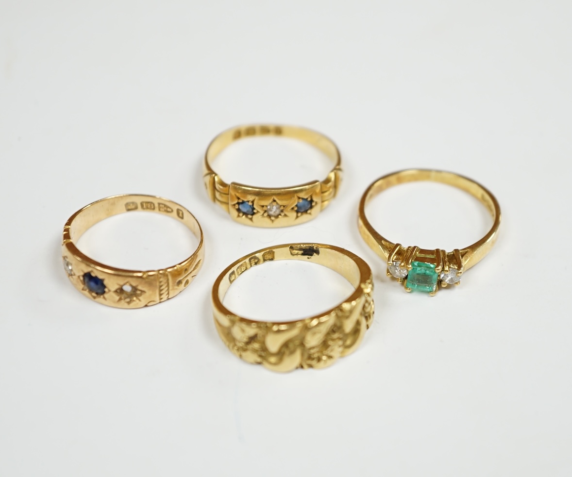 An Edwardian 18ct gold ring, size M, together with three other 18ct gold and gem set rings, including two early 20th century, gross weight 12.9 grams. Condition - fair